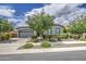 Charming home featuring desert landscaping, a two-car garage, and a neutral color palette at 21711 E Arroyo Verde Dr, Queen Creek, AZ 85142