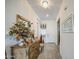 Elegant foyer with a decorative mirror, chandelier, and neutral tile flooring at 21711 E Arroyo Verde Dr, Queen Creek, AZ 85142