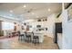 Modern kitchen with white cabinets, a center island, and stainless steel appliances at 21711 E Arroyo Verde Dr, Queen Creek, AZ 85142