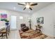 Open-concept living space featuring sitting area, table, and kitchen breakfast bar at 21711 E Arroyo Verde Dr, Queen Creek, AZ 85142