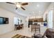 Open-concept living space with dining area, kitchen, and entertainment area at 21711 E Arroyo Verde Dr, Queen Creek, AZ 85142