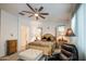 Comfortable main bedroom with a ceiling fan, good natural light, and relaxing decor at 21711 E Arroyo Verde Dr, Queen Creek, AZ 85142