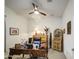 Comfortable office space with a ceiling fan, classic desk, and ample storage at 21711 E Arroyo Verde Dr, Queen Creek, AZ 85142
