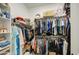 Organized walk-in closet with clothing racks and shelves for ample storage solutions at 21711 E Arroyo Verde Dr, Queen Creek, AZ 85142