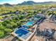 Aerial view of the community pool, recreation facilities, and manicured landscaping, backed by mountain views at 2365 N Springfield St, Buckeye, AZ 85396