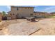 Spacious backyard featuring a stone patio, hot tub area, and low maintenance landscaping, ideal for entertaining at 2365 N Springfield St, Buckeye, AZ 85396