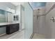 Sleek bathroom showcasing a frameless glass shower, and dark vanity with ample counter space at 2365 N Springfield St, Buckeye, AZ 85396