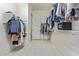 Large walk-in closet with custom shelving and rods, offering ample storage space for clothes and accessories at 2365 N Springfield St, Buckeye, AZ 85396