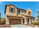 Stunning two-story home with a tile roof, charming shutters, and a convenient two-car garage at 2365 N Springfield St, Buckeye, AZ 85396