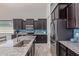 Bright kitchen features granite countertops, stainless appliances, and an undermounted sink at 2365 N Springfield St, Buckeye, AZ 85396