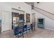 Modern kitchen with stainless steel appliances, island seating, pendant lights and view of the staircase and decor at 2365 N Springfield St, Buckeye, AZ 85396