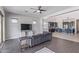 Spacious living room with an open concept layout and tile floors, adjacent to modern kitchen at 2365 N Springfield St, Buckeye, AZ 85396