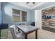 Bright office space with a large window, accent wall, and contemporary desk setup at 2365 N Springfield St, Buckeye, AZ 85396