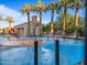 A brightly colored splash pad with sprayers, set among palm trees in a recreation area at 2365 N Springfield St, Buckeye, AZ 85396