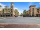A street view featuring palm trees and commercial buildings in a vibrant urban setting at 2365 N Springfield St, Buckeye, AZ 85396