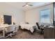 Cozy bedroom with natural light, carpeted floors, and a dedicated workspace at 23730 W Hess Ave, Buckeye, AZ 85326