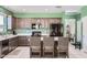 Modern kitchen features stainless appliances, lots of cabinets and tile flooring at 23730 W Hess Ave, Buckeye, AZ 85326