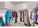 Spacious walk-in closet with ample shelving and storage for clothing and accessories at 23730 W Hess Ave, Buckeye, AZ 85326