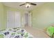 Bedroom featuring a ceiling fan, neutral walls, carpet and a closet at 2519 N 73Rd Dr, Phoenix, AZ 85035