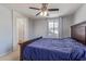 Comfortable bedroom with natural light, ceiling fan, and ample space for furniture at 2519 N 73Rd Dr, Phoenix, AZ 85035