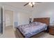 Neutral Primary bedroom with dark wood bed, a ceiling fan and neutral carpet at 2519 N 73Rd Dr, Phoenix, AZ 85035