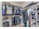 Walk-in closet with ample hanging storage and shelving for clothes and accessories at 2519 N 73Rd Dr, Phoenix, AZ 85035