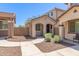 Charming townhouse boasts a welcoming porch and stylish exterior finishes at 2519 N 73Rd Dr, Phoenix, AZ 85035