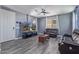 Open-concept living room featuring hard surface floors, and a comfortable sectional sofa at 2519 N 73Rd Dr, Phoenix, AZ 85035