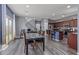 Open-concept living and dining area with stainless steel appliances in kitchen at 2519 N 73Rd Dr, Phoenix, AZ 85035