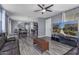 Stylish living area with open floor plan, seamlessly connecting dining and kitchen spaces at 2519 N 73Rd Dr, Phoenix, AZ 85035