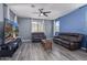 Comfortable living room with modern furniture, hard surface floors, and neutral wall color at 2519 N 73Rd Dr, Phoenix, AZ 85035