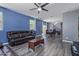 Spacious living room with staircase view, dining area, and plenty of natural light at 2519 N 73Rd Dr, Phoenix, AZ 85035
