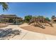 Community playground with slides and covered picnic tables and neighboring townhomes in the background at 2519 N 73Rd Dr, Phoenix, AZ 85035
