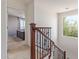 Elegant staircase with decorative iron railing leading to the upper level of the home at 2519 N 73Rd Dr, Phoenix, AZ 85035