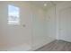 Bathroom featuring a spacious glass enclosed shower and stylish tile at 262 S 164Th Dr, Goodyear, AZ 85338