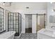 Modern bathroom with custom shower, vintage door, and decorative tile floors at 26264 N 46Th St, Phoenix, AZ 85050