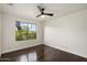 Bright bedroom with hardwood floors and large picture window at 26264 N 46Th St, Phoenix, AZ 85050