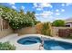 Relaxing backyard hot tub and pool combination with privacy landscaping and block wall at 26264 N 46Th St, Phoenix, AZ 85050