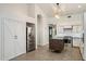 Well-designed kitchen featuring a center island, stainless steel refrigerator, and white cabinets at 26264 N 46Th St, Phoenix, AZ 85050