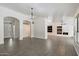 Spacious living room featuring a fireplace, modern lighting fixtures and tile floors at 26264 N 46Th St, Phoenix, AZ 85050
