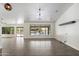 Bright living room with tile floors, modern lighting and a great view of the backyard at 26264 N 46Th St, Phoenix, AZ 85050