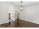 Bright living room with hardwood floors and decorative light fixture at 26264 N 46Th St, Phoenix, AZ 85050