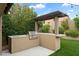 Built-in outdoor grill area with a sink, countertop, and pergola, perfect for outdoor cooking and gatherings at 26264 N 46Th St, Phoenix, AZ 85050