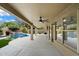Covered patio with ceiling fans and outdoor living space overlooking pool at 26264 N 46Th St, Phoenix, AZ 85050
