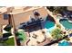 A home featuring a backyard with a swimming pool, a putting green, and a patio for outdoor living at 2712 W Oakgrove Ln, Chandler, AZ 85224