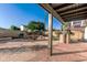 Spacious backyard featuring a built-in grill, dining area and well manicured landscaping at 2712 W Oakgrove Ln, Chandler, AZ 85224