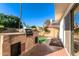 Well-equipped backyard featuring a built-in grill and lush landscaping at 2712 W Oakgrove Ln, Chandler, AZ 85224