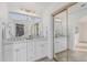 Bright bathroom showcasing double sinks, a stylish mirror, and updated fixtures at 2712 W Oakgrove Ln, Chandler, AZ 85224