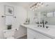 Updated bathroom featuring sleek countertops, modern lighting, and elegant fixtures at 2712 W Oakgrove Ln, Chandler, AZ 85224