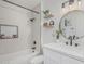 Beautiful bathroom with modern vanity, round mirror, stylish shelves and sleek shower at 2712 W Oakgrove Ln, Chandler, AZ 85224